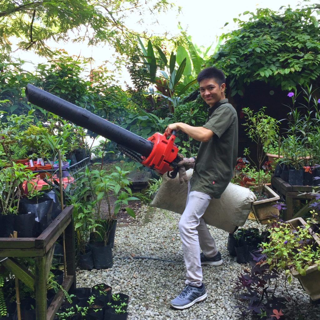 FTS volunteer with a leaf blower